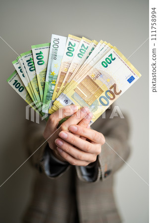 business lady holds euro bills in her hands business lady holds euro bills in her hands 111758994