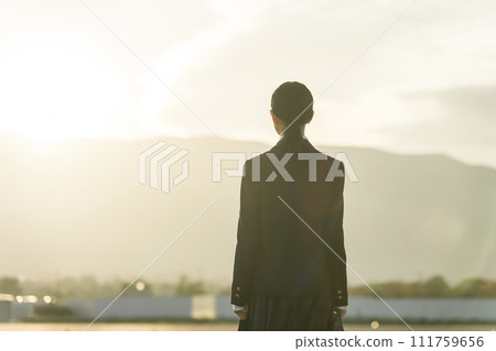 High school students, junior high school students, and high school girls walking in the sunset in the evening (youth, adolescence, worries, bullying) 111759656