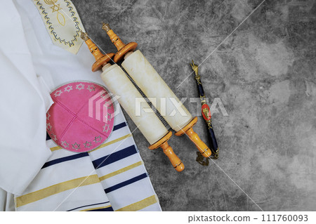 Orthodox Jewish holiday symbols: prayer shawl tallit, prayer holy torah scroll, kippah 111760093