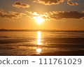 The sea where the setting sun goes down 111761029