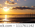 Winter underwater telephone pole and sunset 111761142