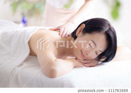 Middle-aged woman receiving beauty treatment 111761689