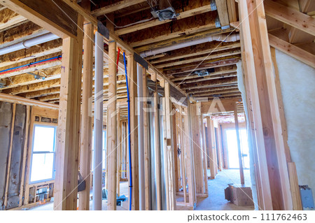 Construction of new residential home includes the insulation of wall Construction of new residential home includes the insulation of wall 111762463