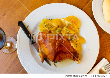 Popular dish of Spanish cuisine is Toston asado Popular dish of Spanish cuisine is Toston asado 111763076
