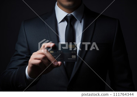Close up of a man in a suit holding a credit card. Generative AI. 111764344