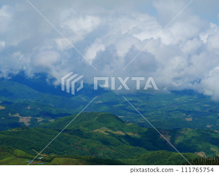 Dramatic sunset over mountain landscape. Beautiful landscape foggy hills twilight time. Blue golden sky sunrise dramatic beautiful landscape mountain. Dawn sky gold dusk time cloudscape with sunlight Dramatic sunset over mountain landscape. Beautiful landscape foggy hills twilight time. Blue golden sky sunrise dramatic beautiful landscape mountain. Dawn sky gold dusk time cloudscape with sunlight 111765754