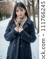 AI beauty standing in the snow “AI generated image” 111766245