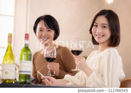 A woman tasting at a wine class A woman tasting at a wine class 111766545