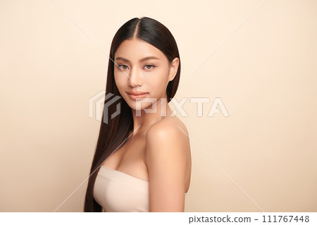Beautiful young asian woman with clean fresh skin on beige background, Face care, Facial treatment, Cosmetology, beauty and spa, Asian women portrait. 111767448