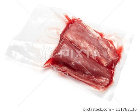 close-up Vacuum packed tuna fillet pieces in transparent plastic for preserving the freshness isolated on white background 111768136