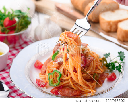 Italian spaghetti (Napolitan) and baguette Italian spaghetti (Napolitan) and baguette 111768202
