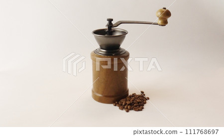 wooden coffee grinder and coffee beans 111768697