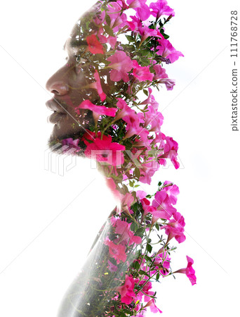 A double exposure profile portrait of a man combined with pink flowers A double exposure profile portrait of a man combined with pink flowers 111768728
