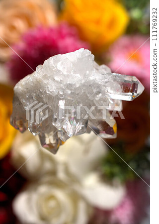 crystal cluster floating on flowers crystal cluster floating on flowers 111769232