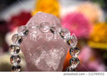Crystals floating on flowers 111769352