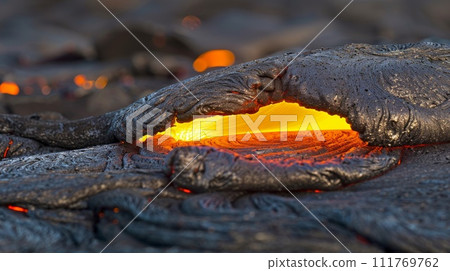 Burning lava in a volcanic eruption, close-up of a flame 111769762