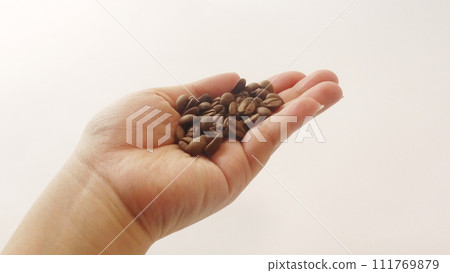 Hand with coffee beans Hand with coffee beans 111769879