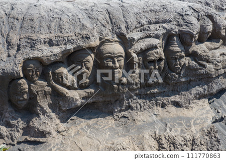 The mystery face carved into rock at entrance of Bentar Candi and Batok volcano in Bromo Tengger Semeru National Park, East Java, Indonesia. 111770863