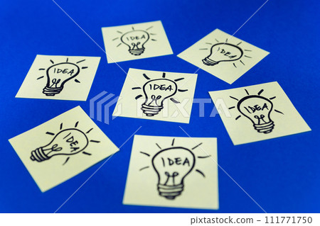 Light bulbs drawn on sticky notes. Hand drawn doodle lineart. Idea, inspiration and creative thinking Light bulbs drawn on sticky notes. Hand drawn doodle lineart. Idea, inspiration and creative thinking 111771750
