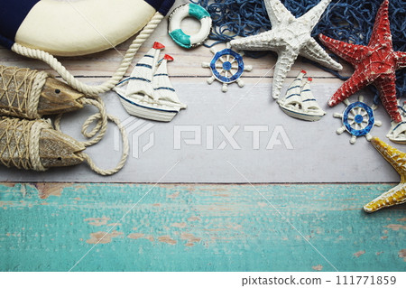 Nautical and summer background top view on wooden background Nautical and summer background top view on wooden background 111771859