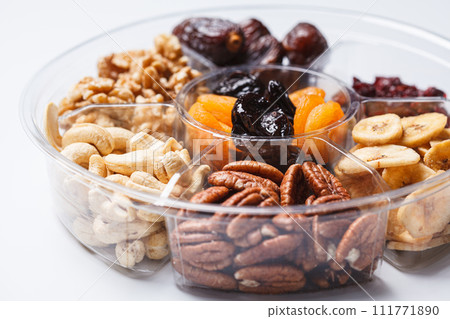 Dried fruits and nuts on a plate to celebrate the Jewish holiday Tu Bi Shvat. Dried fruits and nuts on a plate to celebrate the Jewish holiday Tu Bi Shvat. 111771890