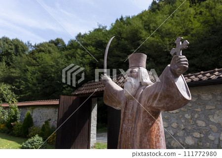 Monument of Hadzi Milentije at medieval monastery Raca at Tara mountain in western Serbia 111772980