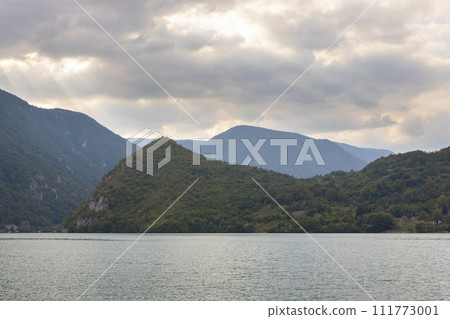 Lake Perucac and Tara mountain with amazing sky at sunset 111773001