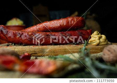 Sausages with cheese fried with spices and herbs 111773050