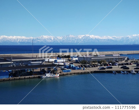 The Tateyama Mountain Range across the sea The Tateyama Mountain Range across the sea 111775596