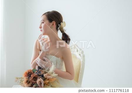 Young woman in wedding dress 111776118