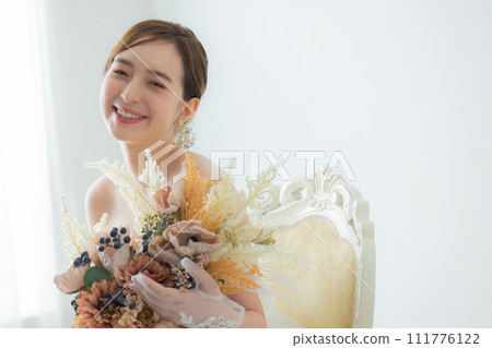 Young woman in wedding dress Young woman in wedding dress 111776122