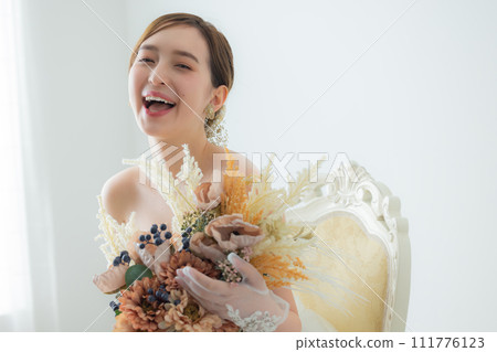 Young woman in wedding dress Young woman in wedding dress 111776123