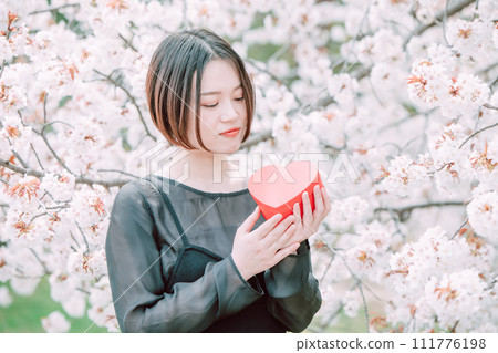 Sakura present young woman Sakura present young woman 111776198