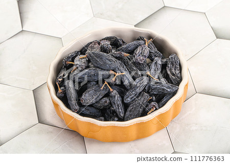 Blue raisin - dry grape berries 111776363