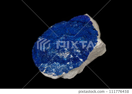 Macro mineral stone Azurite in siltstone against black background 111776438