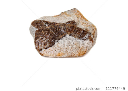 macro mineral stone Staurolite on a white background macro mineral stone Staurolite on a white background 111776449