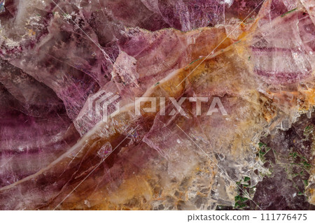 Macro stone mineral Fluorite on a black background Macro stone mineral Fluorite on a black background 111776475