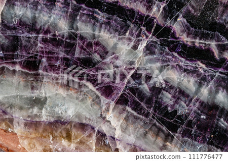 Macro stone mineral Fluorite on a black background Macro stone mineral Fluorite on a black background 111776477