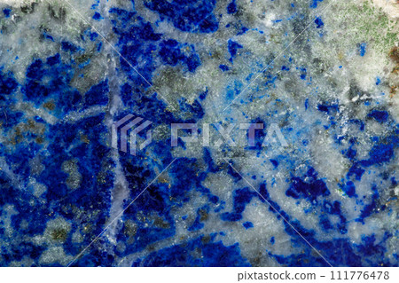Macro of mineral stone Lazurite on a black background Macro of mineral stone Lazurite on a black background 111776478