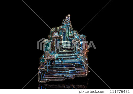 Macro of the stone bismuth mineral on a black background 111776481