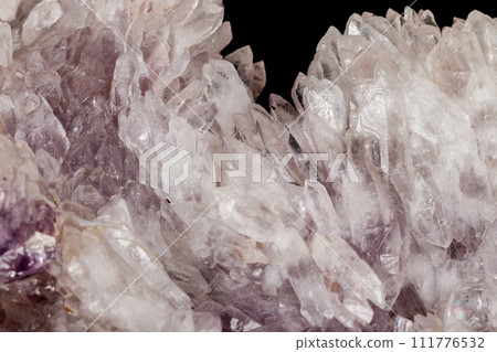 Macro of amethyst mineral stone on black background Macro of amethyst mineral stone on black background 111776532