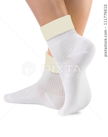 Side view of beautiful woman foot dressed in new nice and soft natural cotton fabric blank white socks 111776618