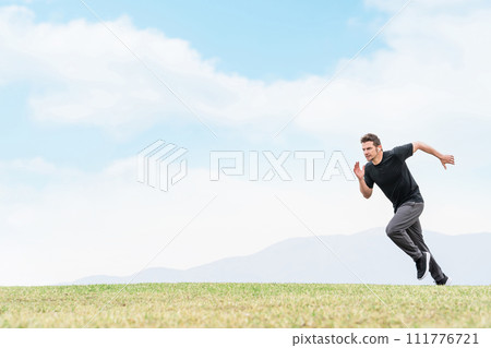 Athlete caucasian man in sportswear practicing sprinting in park for training Athlete caucasian man in sportswear practicing sprinting in park for training 111776721