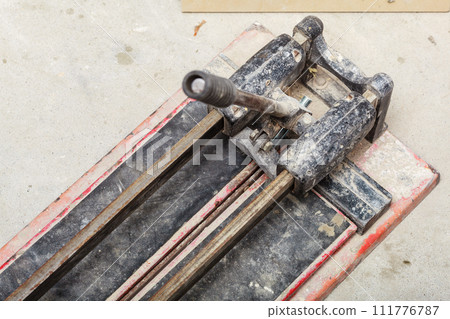 Cutting tiles tool tile cutter closeup 111776787