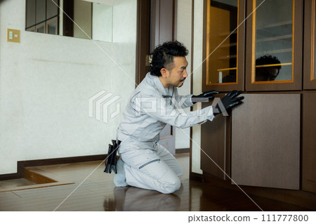 A worker inspecting fittings 111777800