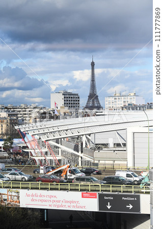 View of the Eiffel Tower from the roofs of the buildings towards Porte de Versailles View of the Eiffel Tower from the roofs of the buildings towards Porte de Versailles 111777869