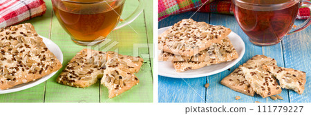 crispy bread with seeds of sunflower, flax and sesame seeds with a cup of tea on a green wooden background crispy bread with seeds of sunflower, flax and sesame seeds with a cup of tea on a green wooden background 111779227