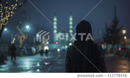 Silhouette of Woman in Niqab at Dusk Silhouette of Woman in Niqab at Dusk 111779556