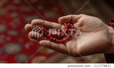 Hands Clasping a Rosary Hands Clasping a Rosary 111779621