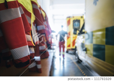 Uniforms and ambulance cars of emergency medical service. 111781020